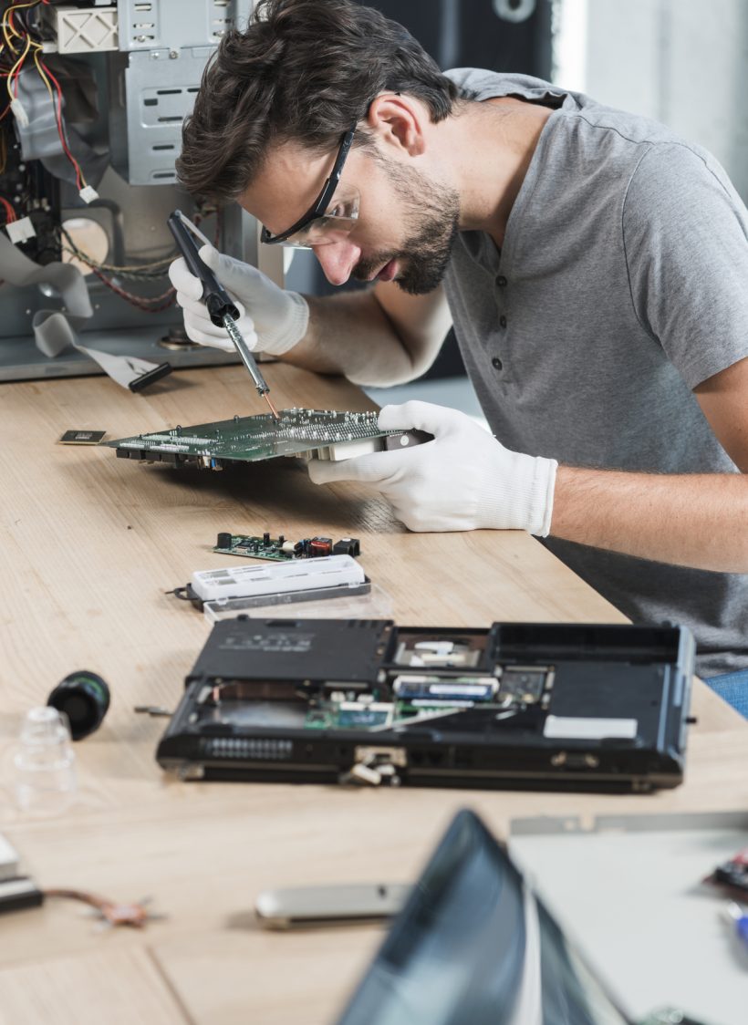 male-technician-repairing-comput